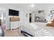 Bright bedroom with neutral tones, ceiling fan, and dresser, with views of a closet and en-suite bathroom at 817 Old Castle Loop, Myrtle Beach, SC 29579