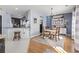 Dining area with an adjacent kitchen, featuring an elegant chandelier at 817 Old Castle Loop, Myrtle Beach, SC 29579