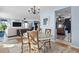 Light-filled dining room with hardwood floors and a chandelier at 817 Old Castle Loop, Myrtle Beach, SC 29579