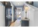 Bright entryway featuring a wooden door, stylish decor, and hardwood floors leading into the home at 817 Old Castle Loop, Myrtle Beach, SC 29579