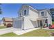 Beautiful two-story home with attached garage, paved walkway, and charming front entrance at 817 Old Castle Loop, Myrtle Beach, SC 29579