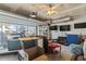 A large garage with a sizable window is set up as an entertaining space, has a TV and blue dresser at 817 Old Castle Loop, Myrtle Beach, SC 29579