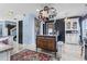 Open kitchen featuring a unique center island with a pot rack, granite countertops, and modern appliances at 817 Old Castle Loop, Myrtle Beach, SC 29579