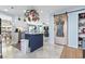 Open kitchen with central island, pot rack, and decorative sliding barn door at 817 Old Castle Loop, Myrtle Beach, SC 29579