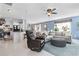 Open-concept living room featuring hardwood floors, a comfortable seating area, and an adjacent kitchen at 817 Old Castle Loop, Myrtle Beach, SC 29579