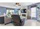 Cozy living room featuring a modern fireplace, comfortable seating, and natural light from the windows at 817 Old Castle Loop, Myrtle Beach, SC 29579