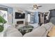 Open living room with modern decor, comfortable seating, and an adjacent staircase to the upper level at 817 Old Castle Loop, Myrtle Beach, SC 29579