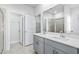 Modern bathroom with gray vanity and walk-in shower at 842 Cypress Preserve Circle, Longs, SC 29568