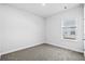 Simple bedroom with neutral walls and carpet at 842 Cypress Preserve Circle, Longs, SC 29568