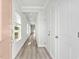 Bright hallway with light walls and wood-look flooring at 842 Cypress Preserve Circle, Longs, SC 29568