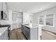 Modern kitchen with gray cabinets, stainless steel appliances, and island at 842 Cypress Preserve Circle, Longs, SC 29568