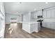 Modern kitchen featuring gray cabinets, quartz countertops, and island at 842 Cypress Preserve Circle, Longs, SC 29568