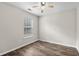 Bright bedroom featuring wood-look floors and a ceiling fan at 869 Silvercrest Dr., Myrtle Beach, SC 29579