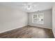 Spacious bedroom with wood-look flooring and ceiling fan at 869 Silvercrest Dr., Myrtle Beach, SC 29579