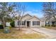 Tan house with black shutters and a driveway at 869 Silvercrest Dr., Myrtle Beach, SC 29579