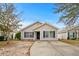 Tan house with dark brown trim and driveway at 869 Silvercrest Dr., Myrtle Beach, SC 29579