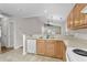 Kitchen features light wood cabinets, tile flooring, and a breakfast bar at 869 Silvercrest Dr., Myrtle Beach, SC 29579