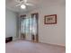 Bedroom with window, carpet, and tropical-themed curtains at 880 Fairway Dr. # 302Bb, Longs, SC 29568