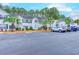 Front view of townhouses with parking and landscaping at 880 Fairway Dr. # 302Bb, Longs, SC 29568