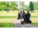 Golf carts traveling down a path on the course at 880 Fairway Dr. # 302Bb, Longs, SC 29568