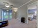 Living room with view into bedroom and patio at 880 Fairway Dr. # 302Bb, Longs, SC 29568