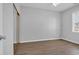Bright bedroom featuring neutral walls, ceiling fan, and stylish wood-look flooring at 901 West Port Dr. # 1706, North Myrtle Beach, SC 29582