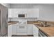 Practical kitchen layout with modern appliances and ample counter space, perfect for easy meal preparation and cozy dining at 901 West Port Dr. # 1706, North Myrtle Beach, SC 29582