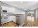 Modern kitchen featuring white cabinets, stainless steel appliances, and hardwood floors at 901 West Port Dr. # 1706, North Myrtle Beach, SC 29582