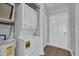 Efficient laundry area with stacked washer and dryer, and easy access to utilities and extra storage at 901 West Port Dr. # 1706, North Myrtle Beach, SC 29582