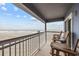 Ocean view balcony with chairs and table at 9530 Shore Dr. # 3-G, Myrtle Beach, SC 29572