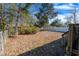 Fenced backyard with mature trees and landscaping at 1020 Thomas Ave., North Myrtle Beach, SC 29582