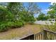 Spacious backyard with lush greenery, mature trees, and a privacy fence at 1020 Thomas Ave., North Myrtle Beach, SC 29582