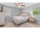 Bedroom with ceiling fan, two windows, and a light-colored wood floor at 1020 Thomas Ave., North Myrtle Beach, SC 29582