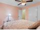 Bedroom featuring neutral paint, ceiling fan, closet, and Queen bed with seashell pattern bedspread at 1020 Thomas Ave., North Myrtle Beach, SC 29582