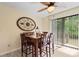 Cozy dining area features modern lighting, wood table set and sliding door to the outside at 1020 Thomas Ave., North Myrtle Beach, SC 29582