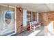 Front porch with brick columns, white railing and bench at 1020 Thomas Ave., North Myrtle Beach, SC 29582