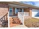 Front porch with white railing and brick steps leading to the entrance at 1020 Thomas Ave., North Myrtle Beach, SC 29582