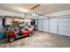 Two-car garage with golf cart and storage shelving at 1020 Thomas Ave., North Myrtle Beach, SC 29582