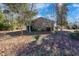 Brick house with mature trees and landscaping in the backyard at 1020 Thomas Ave., North Myrtle Beach, SC 29582