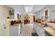 Bright kitchen featuring white cabinets, laminate countertops, and modern appliances, ideal for culinary enthusiasts at 1020 Thomas Ave., North Myrtle Beach, SC 29582