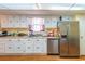 Kitchen with white cabinets, stainless steel appliances, and double sink at 1020 Thomas Ave., North Myrtle Beach, SC 29582