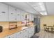 Bright kitchen features stainless appliances, wood countertops, and white cabinetry at 1020 Thomas Ave., North Myrtle Beach, SC 29582