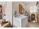 Functional laundry room with washer, dryer, water heater, and storage cabinets at 1020 Thomas Ave., North Myrtle Beach, SC 29582