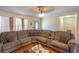 Living room with sectional sofa, hardwood floors and view into dining area at 1020 Thomas Ave., North Myrtle Beach, SC 29582