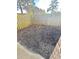 Small fenced backyard with mulch and a concrete patio area at 1025 Carolina Rd. # H4, Conway, SC 29526