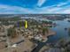 Aerial view of the property and surrounding lake at 103 Lakeside Dr., Tabor City, NC 28463