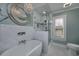 Bathroom with marble tile, a soaking tub, and a walk-in shower at 103 Lakeside Dr., Tabor City, NC 28463