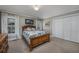 Cozy bedroom with wood bed frame, window with shutters and large closet at 103 Lakeside Dr., Tabor City, NC 28463