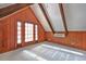 Bright bonus room with wood walls, vaulted ceiling, and French doors at 103 Lakeside Dr., Tabor City, NC 28463