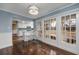 Bright dining area with hardwood floors and French doors leading to a porch at 103 Lakeside Dr., Tabor City, NC 28463